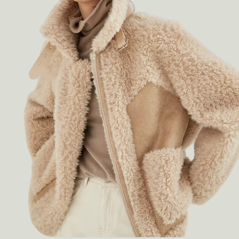 Full-length view of a women's Renard sherpa coat, showcasing its fashionable design and comfort