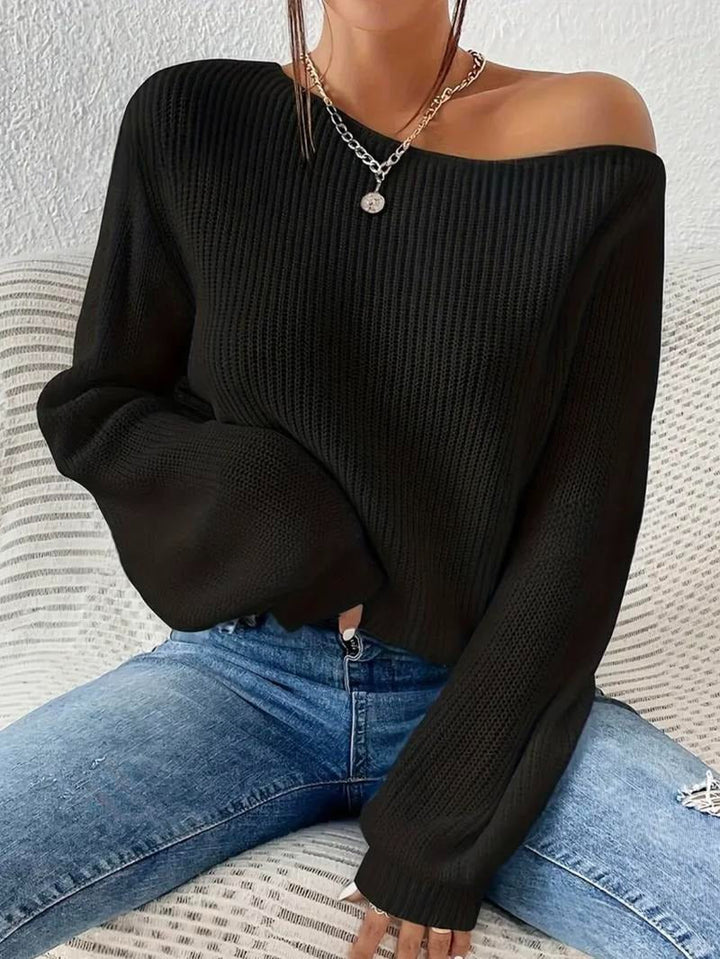 Model wearing a sophisticated ribbed off-shoulder top, highlighting its elegant drape and modern fit.