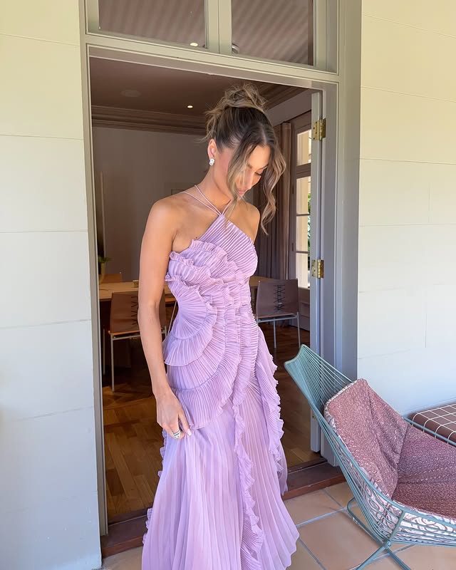Elegant women's long halter dress with ruffles, suitable for wedding guests, proms, and special occasions.