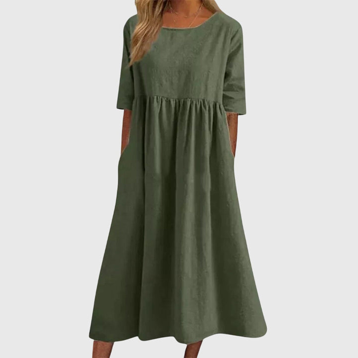 Chic women's short-sleeve dress. Elegant and comfortable, this versatile style is perfect for summer casual or party fashion.