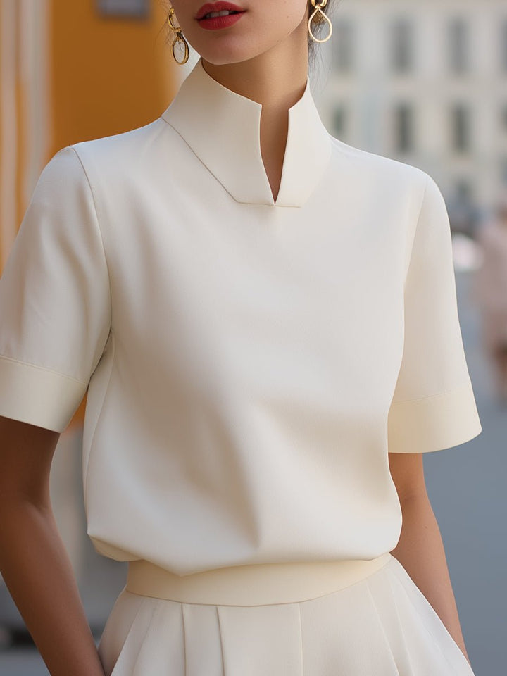 Professional women's short sleeve mandarin collar work blouse. Elegant relaxed fit top for the office.