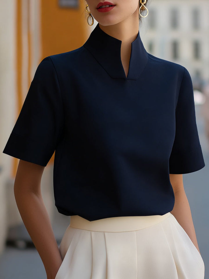 Women's short sleeve stand collar blouse. Elegant, relaxed fit top, perfect for office or casual wear.