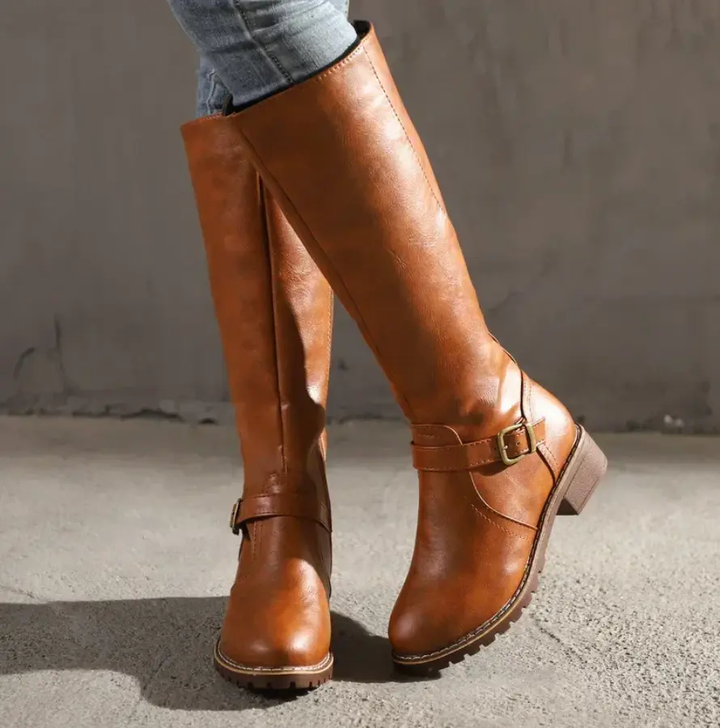 Elegant women's Siena knee-high boots in rich brown faux leather with a sturdy block heel, perfect for winter fashion