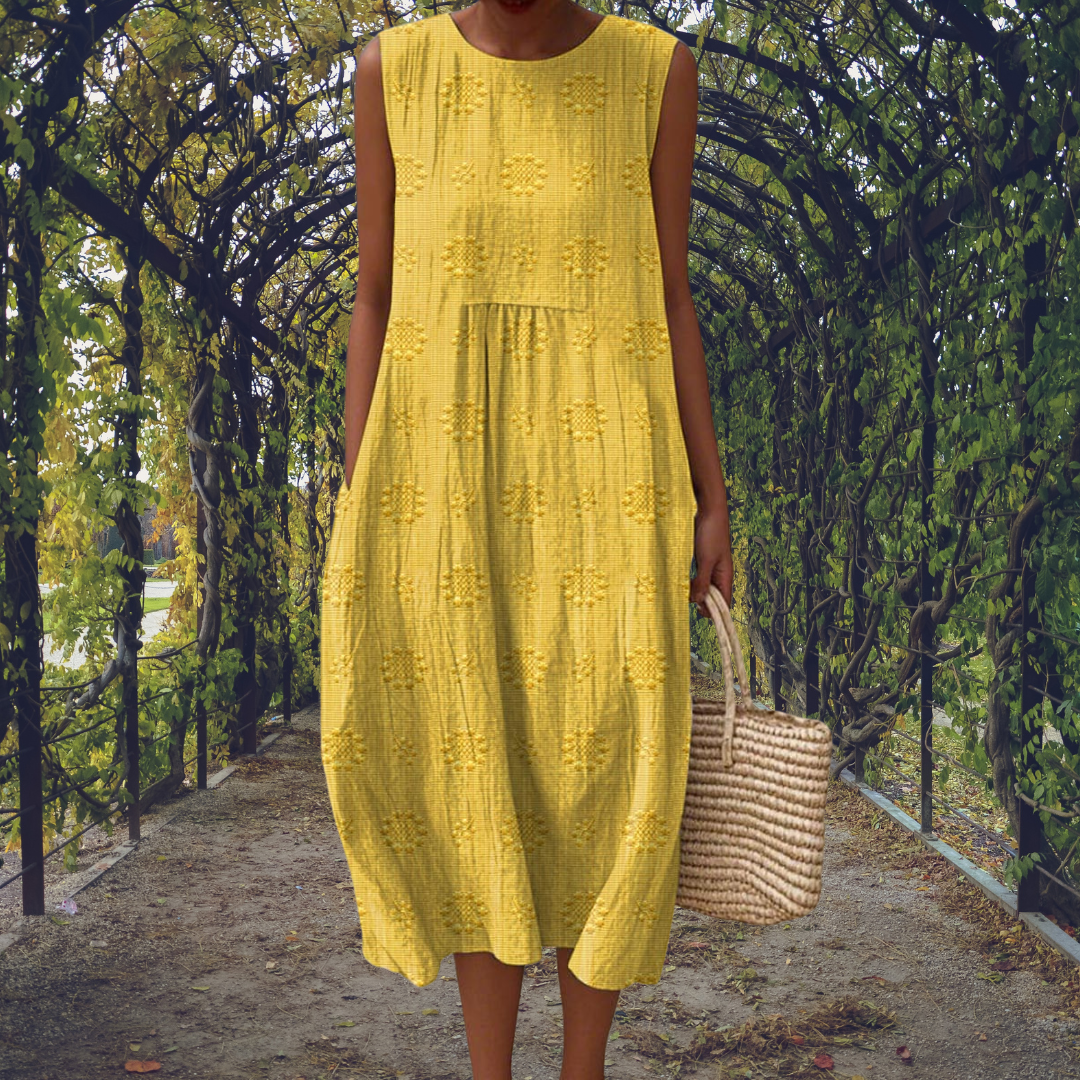 Textured sleeveless midi dress for women, elegant and flowy, ideal for summer casual or day events. Round neck.