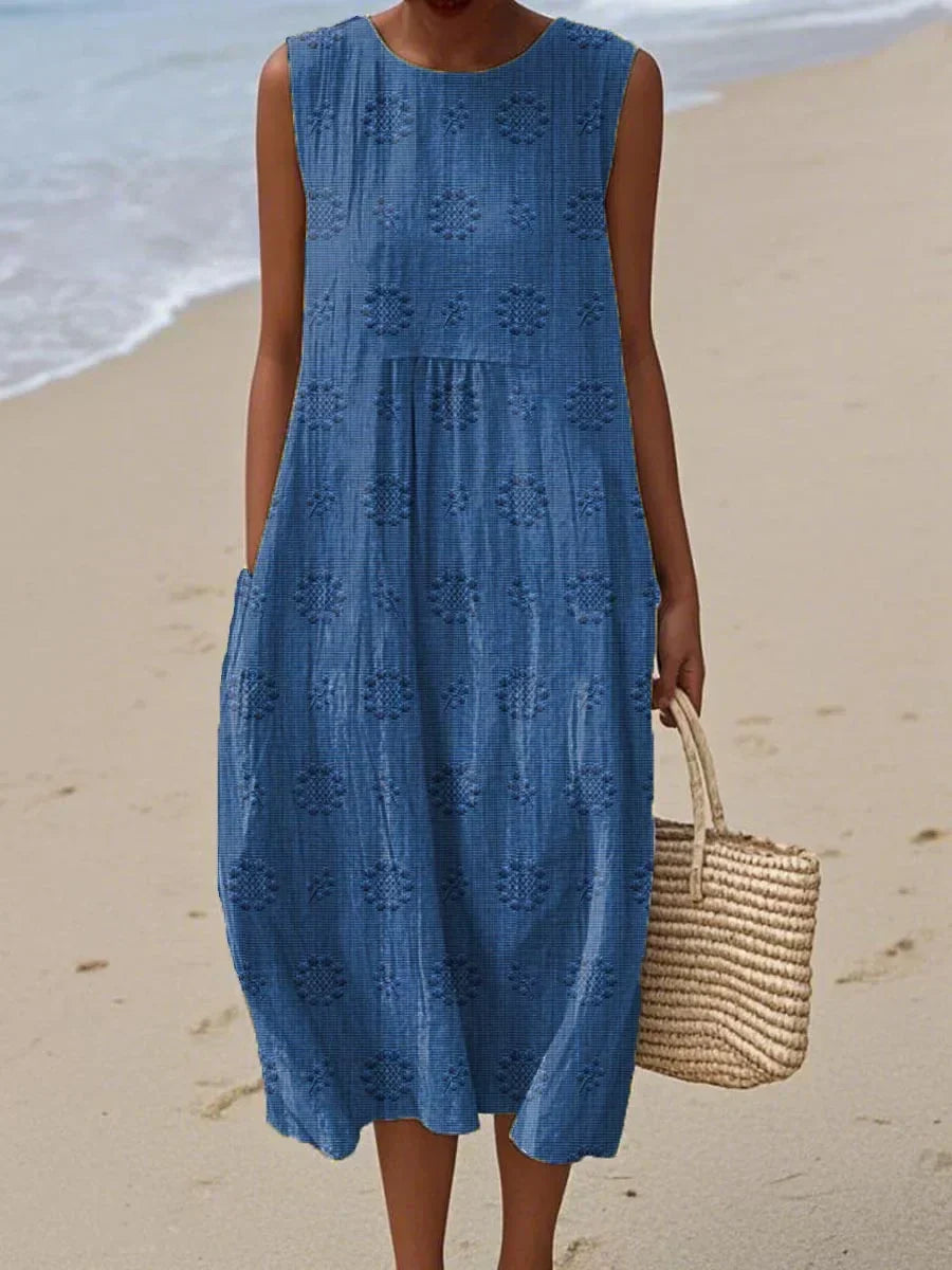 Comfortable loose-fit midi dress for women, featuring a chic sleeveless design and elegant round neck. Versatile spring/summer.