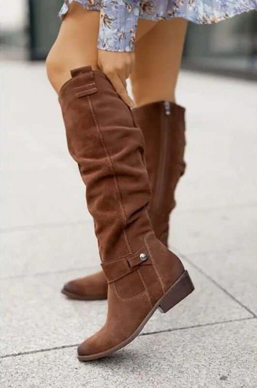 Classic women's knee-high boots crafted from luxurious, soft black suede for an elegant winter look.
