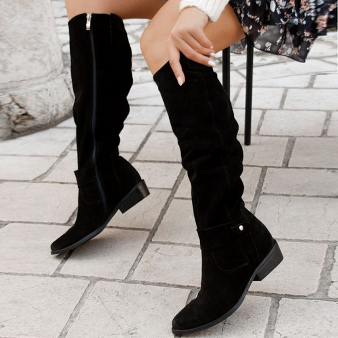Fashionable women's knee-high boots featuring premium soft gray suede, a versatile winter wardrobe staple.
