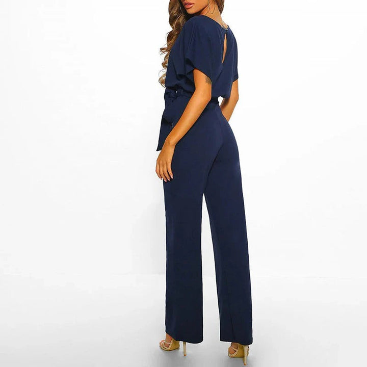 Trendy women's solid color jumpsuit, a chic one-piece outfit for fashion-forward styling.