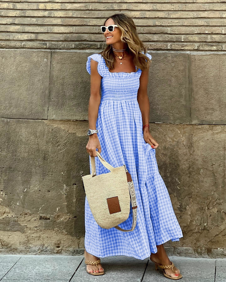 Flowy women's tiered maxi dress with stylish square neck and delicate ruffle sleeves for summer.