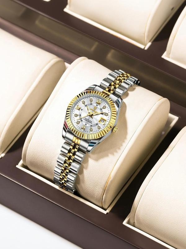 Close-up of a women's silver and gold two-toned analog watch with a durable stainless steel band, classic timepiece.