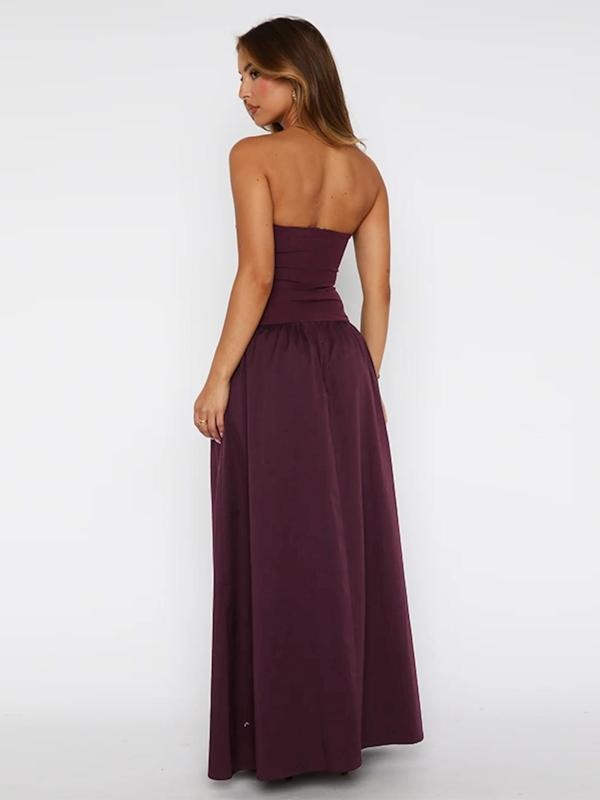 Close-up of the elegant strapless bodice and flowing skirt of a women's maxi evening dress.