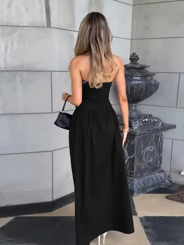 Full shot of a women's strapless maxi dress with a gracefully flowing skirt, an elegant summer dress.