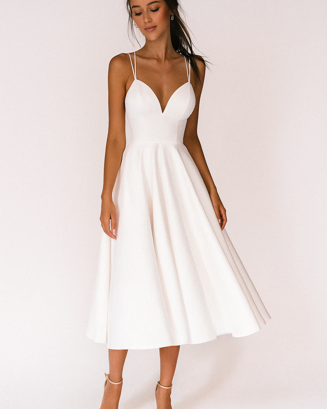 Elegant women's strappy satin midi dress in navy, perfect for a wedding guest or formal occasion