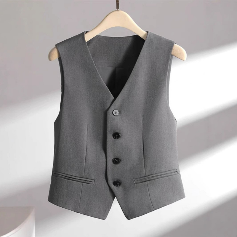 Sophisticated women's tailored V-neck vest, ideal for layering or solo wear in an office setting.