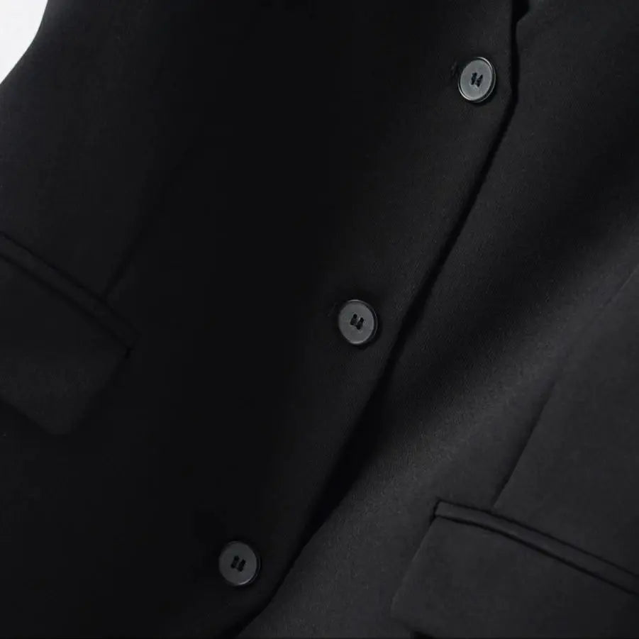 Close-up of a tailored V-neck vest for women, highlighting the elegant fabric and sharp cut.