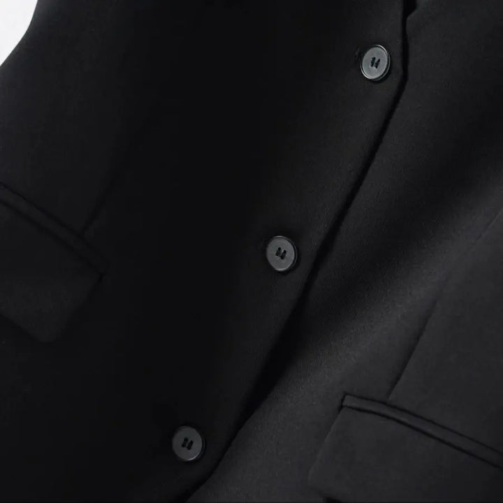 Close-up of a tailored V-neck vest for women, highlighting the elegant fabric and sharp cut.