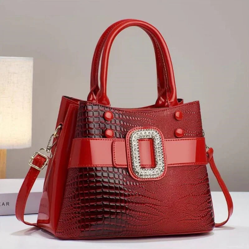 Elegant women's textured lizard handbag, perfect fashion accessory for any outfit.