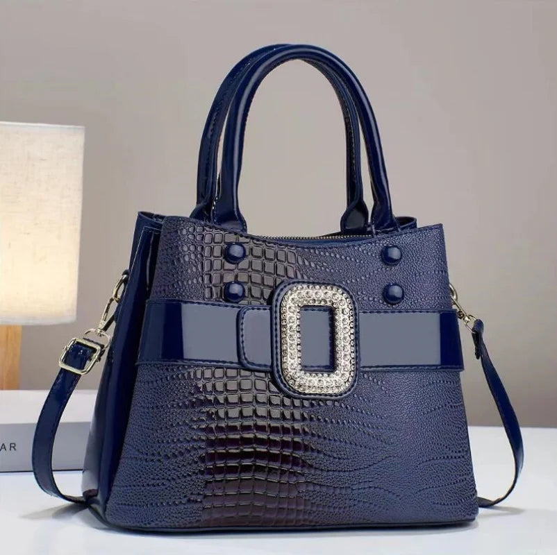 Chic women's crossbody bag made from textured lizard leather, combining style and utility.