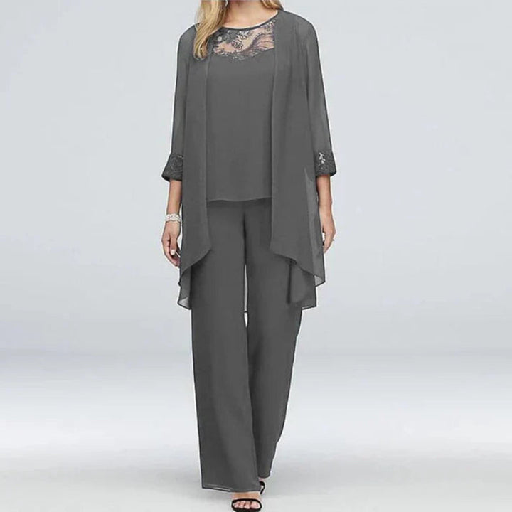 Sophisticated women's pant set for spring, including a matching blazer, camisole, and comfortable trousers.