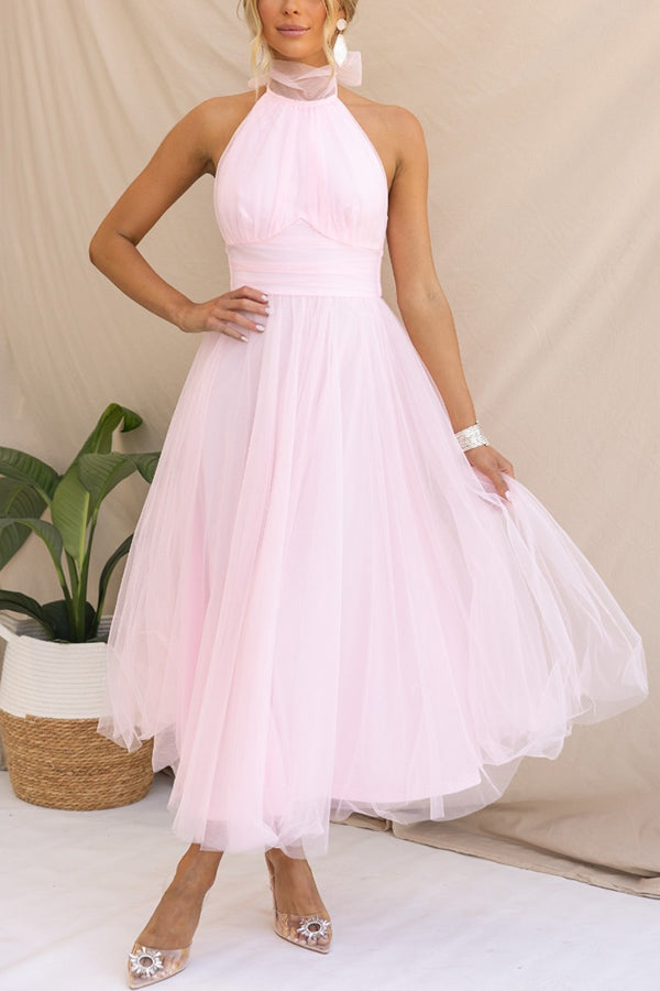 Woman modeling elegant tulle delight midi dress, perfect for a wedding guest or special occasion.