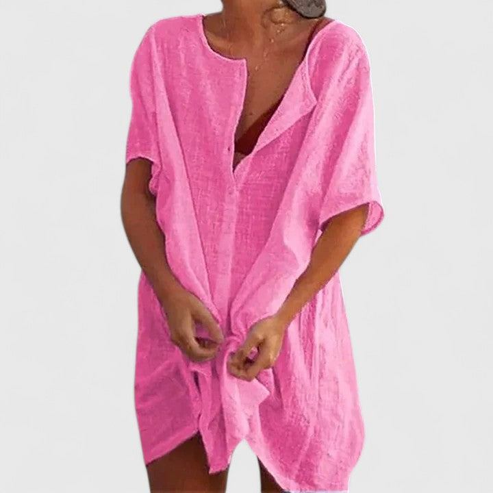 Stylish women's summer tunic dress. Flowy design, super comfy for warm weather. Elegant and versatile apparel.