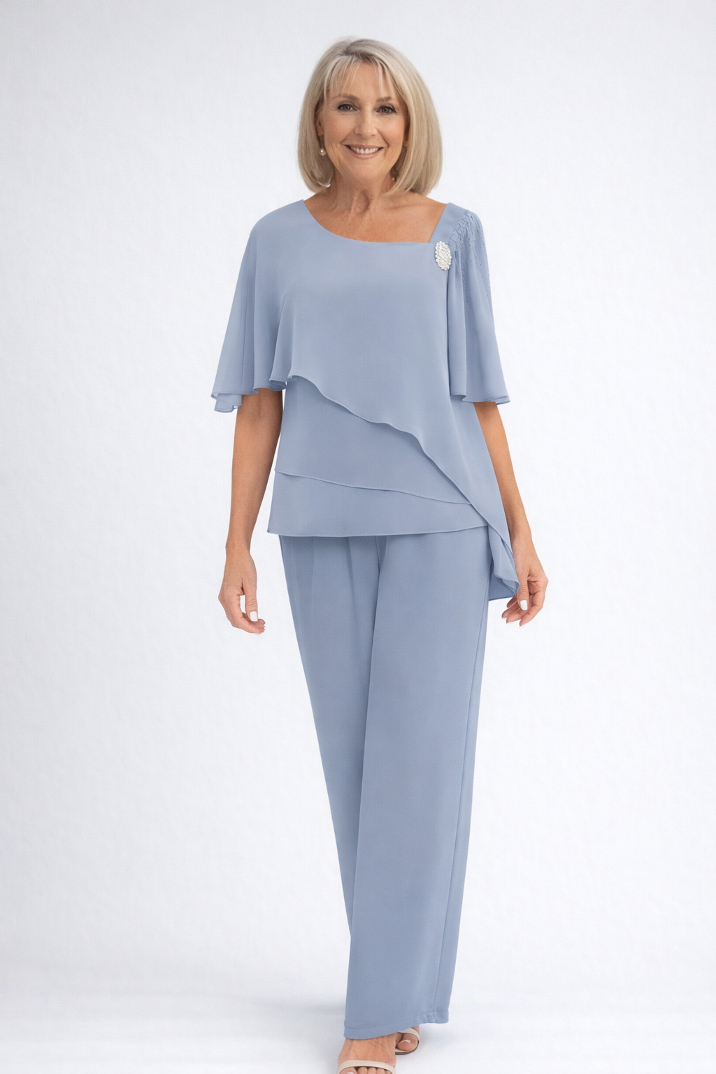Elegant women's two-piece cape top and trouser set, perfect for formal events & special occasions.