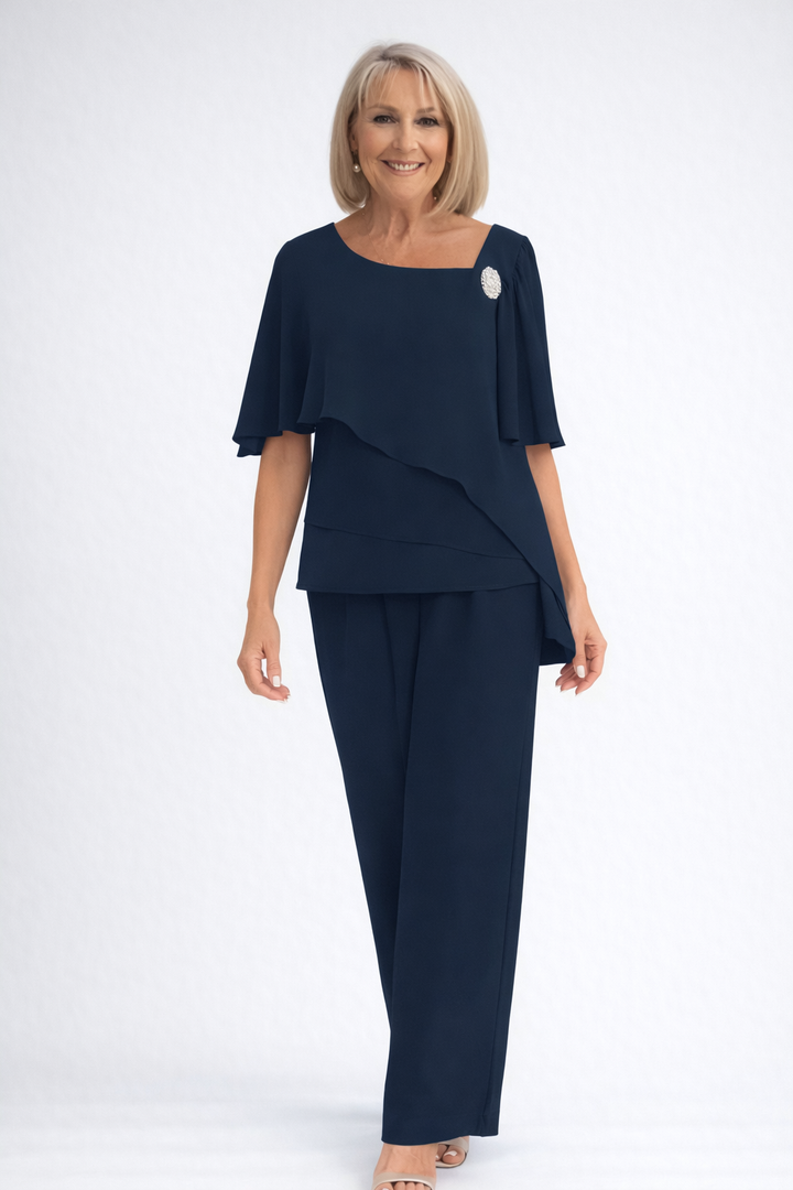 Sophisticated women's formal two-piece set with a pearl-detailed cape top and elegant wide-leg trousers.