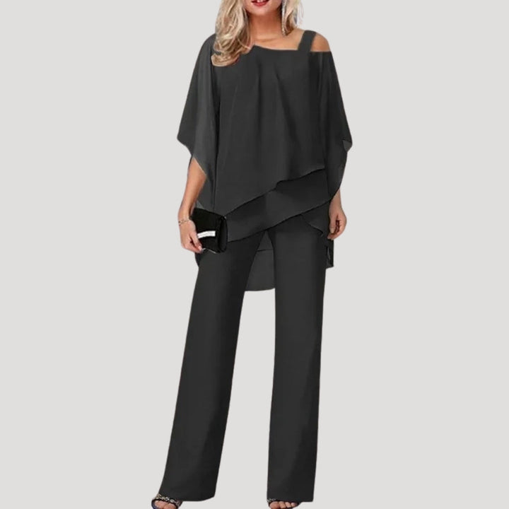 Women's formal two-piece pant set, featuring wide-leg trousers & asymmetric top. Ideal for wedding guests.