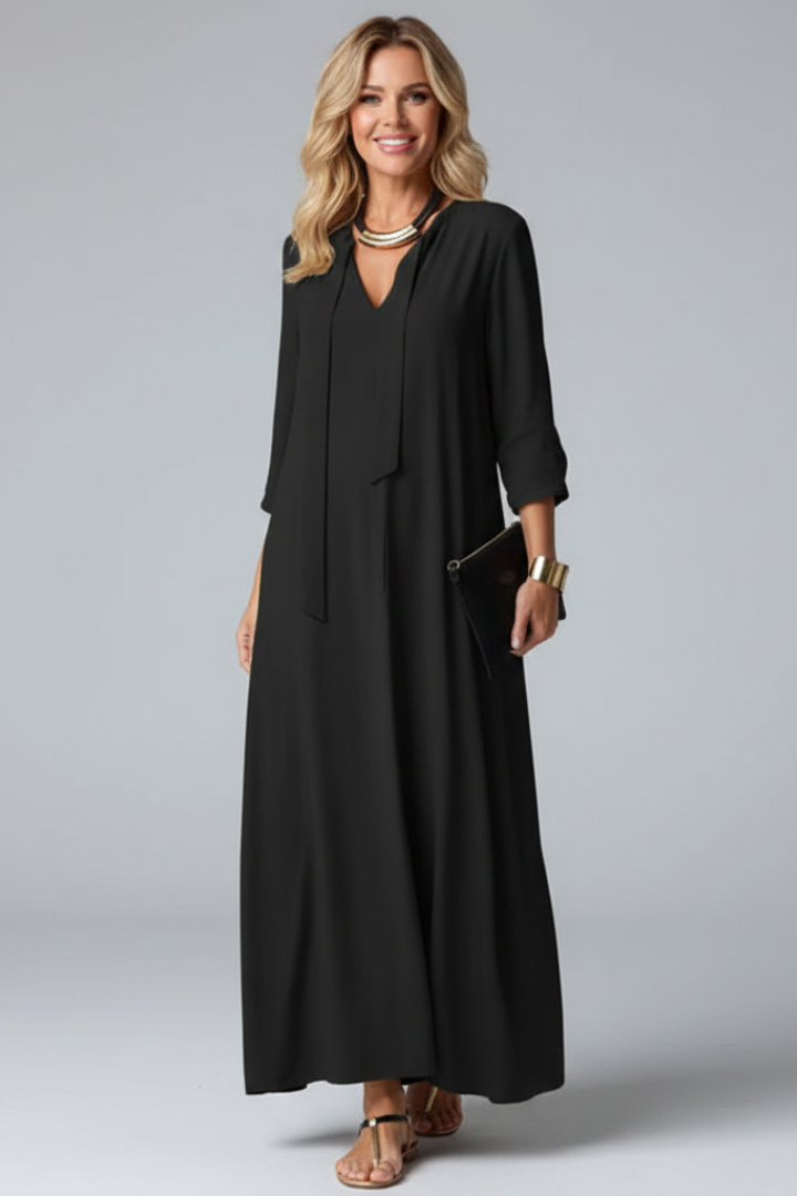 Sophisticated women's V-neck maxi dress with long sleeves, ideal for casual chic looks.