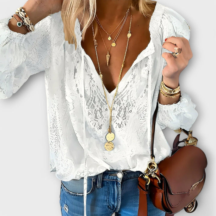 Elegant women's V-neck long sleeve lace blouse. Perfect for casual chic or office wear, offering effortless style.