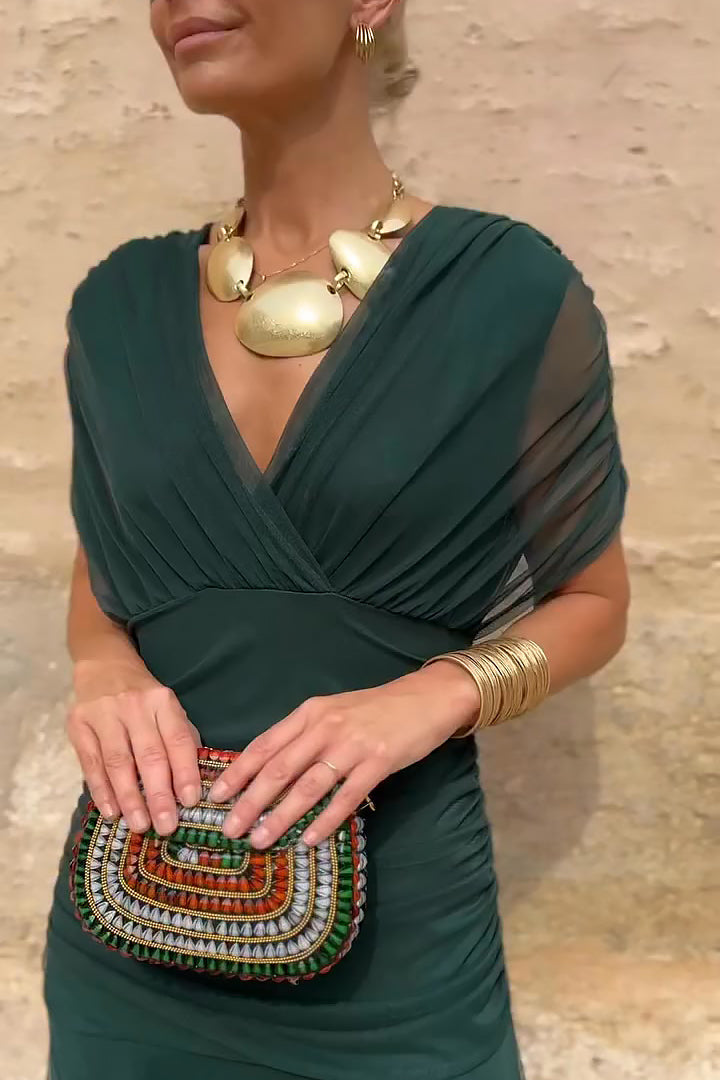 Luxurious women's maxi wedding guest dress, V-neck design with graceful draped sleeves for an elegant look.