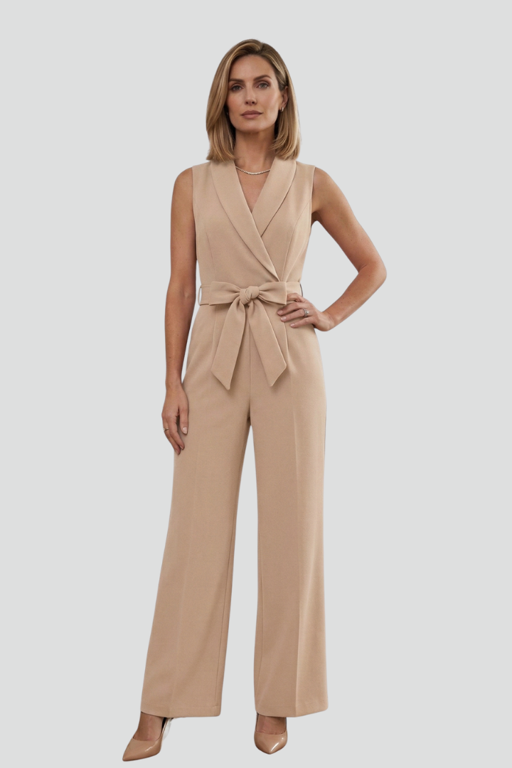 Women's sleeveless V-neck jumpsuit, showcasing the flattering tie waist and wide-leg design. Elegant & comfortable.