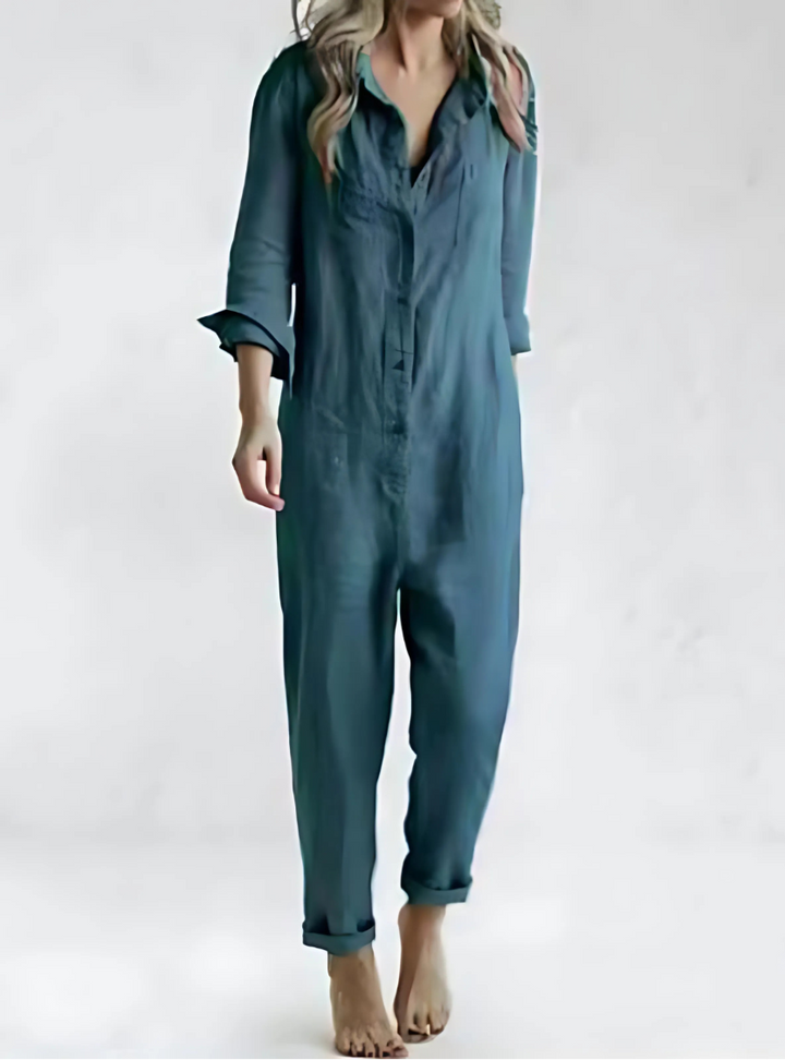 Chic women's relaxed fit jumpsuit with button front, pockets, versatile for casual or elegant wear.