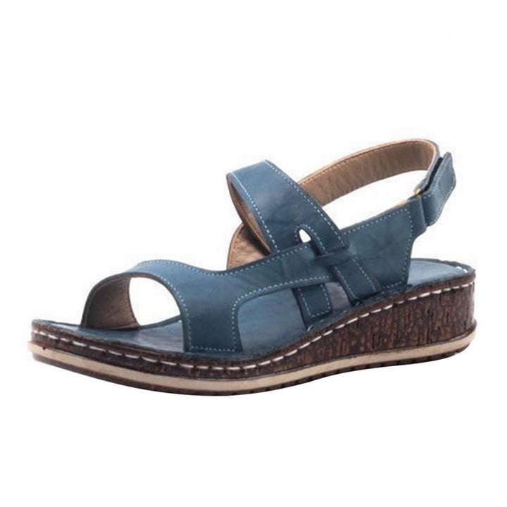 Elegant ladies' summer wedge sandals, combining chic style with comfortable design for warm weather fashion.