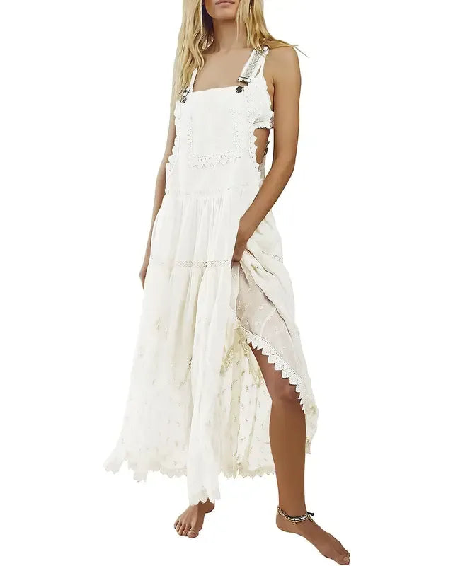 Stylish women's lace tiered maxi dress in white, featuring flowing fabric and an elegant, bridal-inspired design