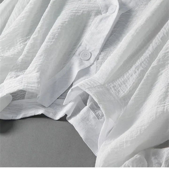 Casual yet elegant women's linen blend top with distinctive balloon sleeves, offering a breathable and versatile summer style.