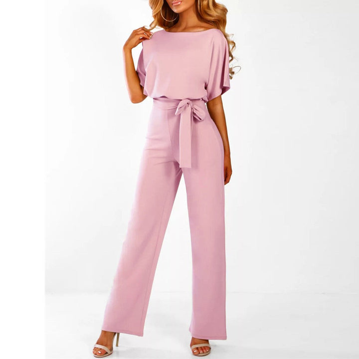 Women's elegant wide-leg belted jumpsuit. A versatile one-piece outfit for sophisticated summer fashion.
