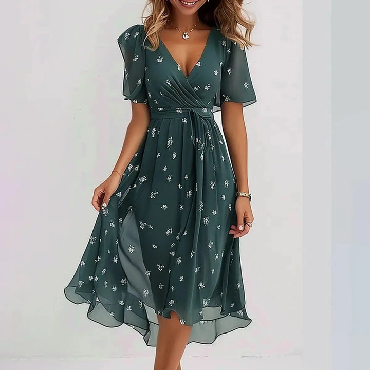 Woman in a beautiful V-neck wrap mini dress. A-line style short dress, perfect for summer fashion or evening events.