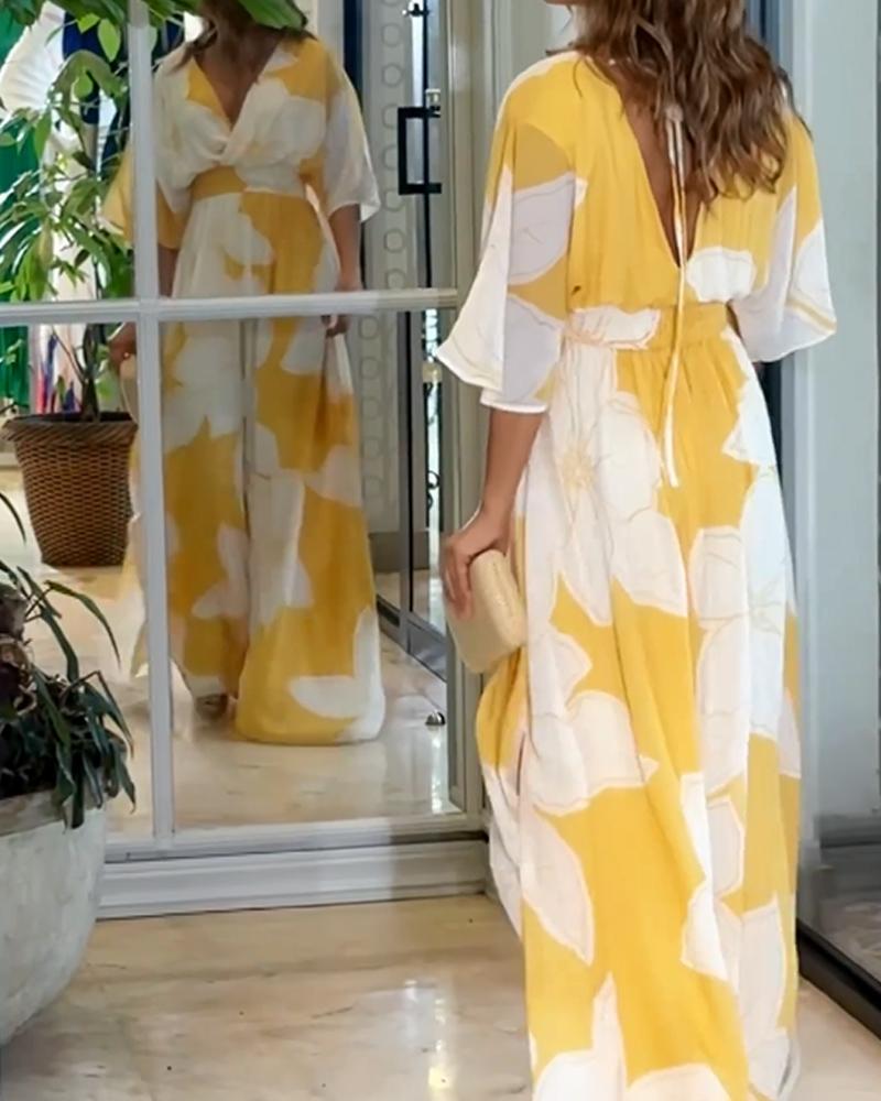 Comfortable women's yellow floral V-neck maxi dress with flutter sleeves, a chic choice for beach vacations.