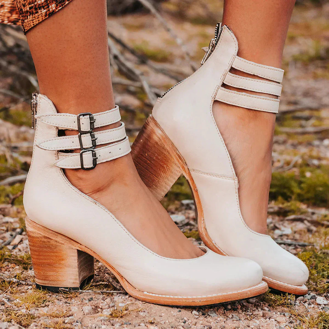 "Elegant women's block heel ankle boots in black, with round toe and back zipper, perfect for chic and comfortable wear."