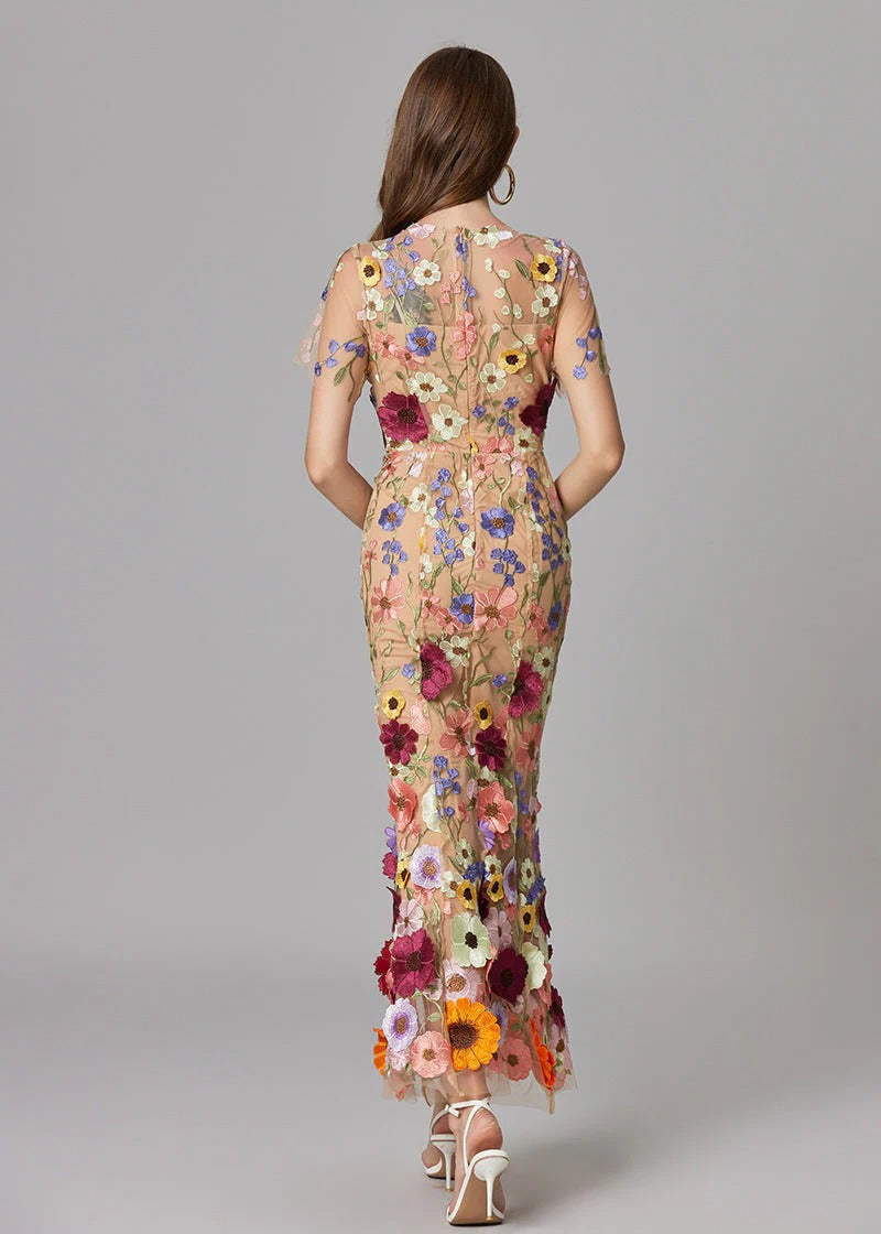 Chic formal evening gown in dark pink, a mermaid style with delicate sheer sections & 3D florals.