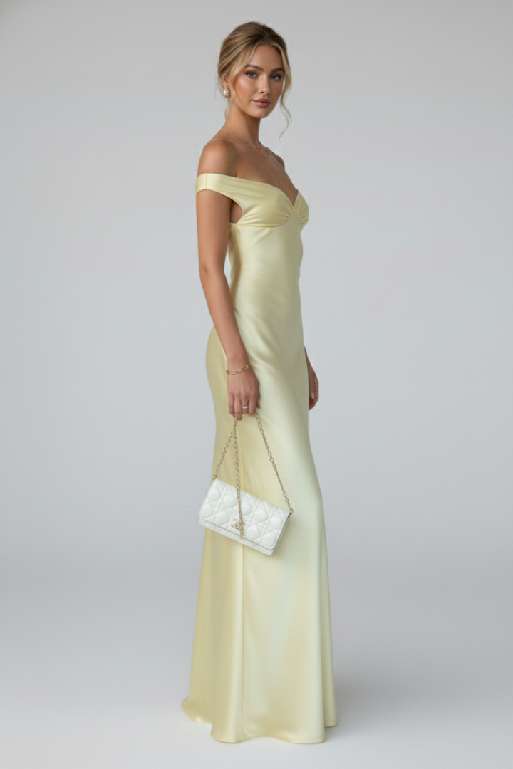 Beautiful women's off-shoulder maxi dress, featuring a fitted elegant upper & long flowing skirt for chic occasion wear.