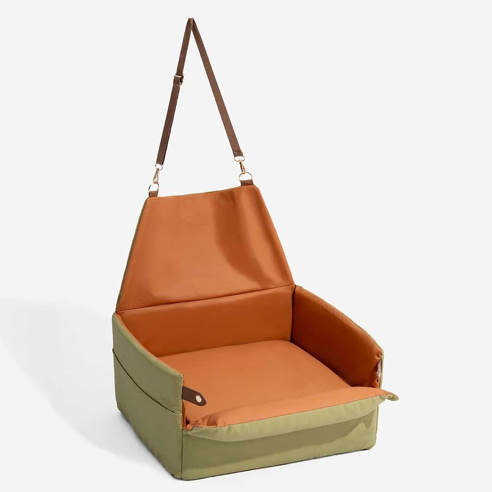 Portable elevated pet car booster bed offers small dogs a comfortable, safe ride with an elevated view.