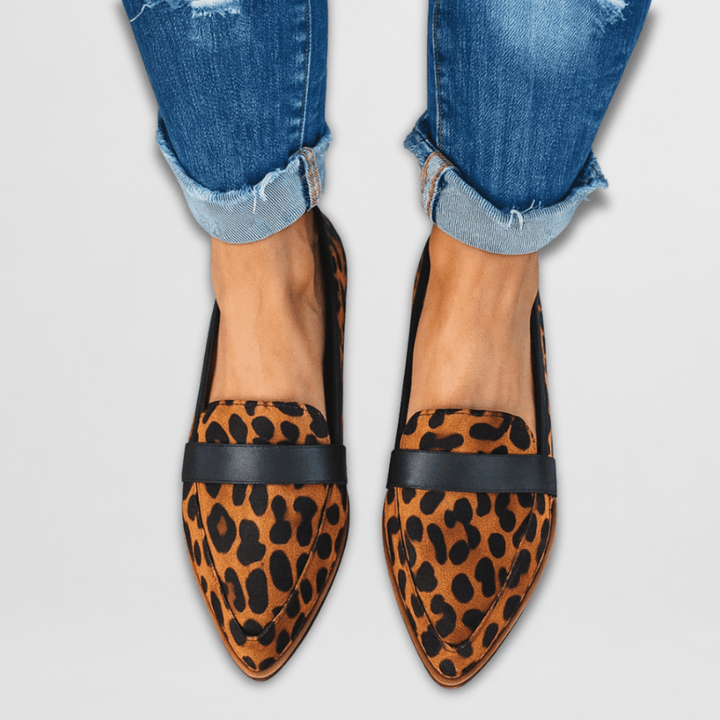 Close-up: leopard print Emily loafers showing textured fabric and stitched trim — women's leopard loafers