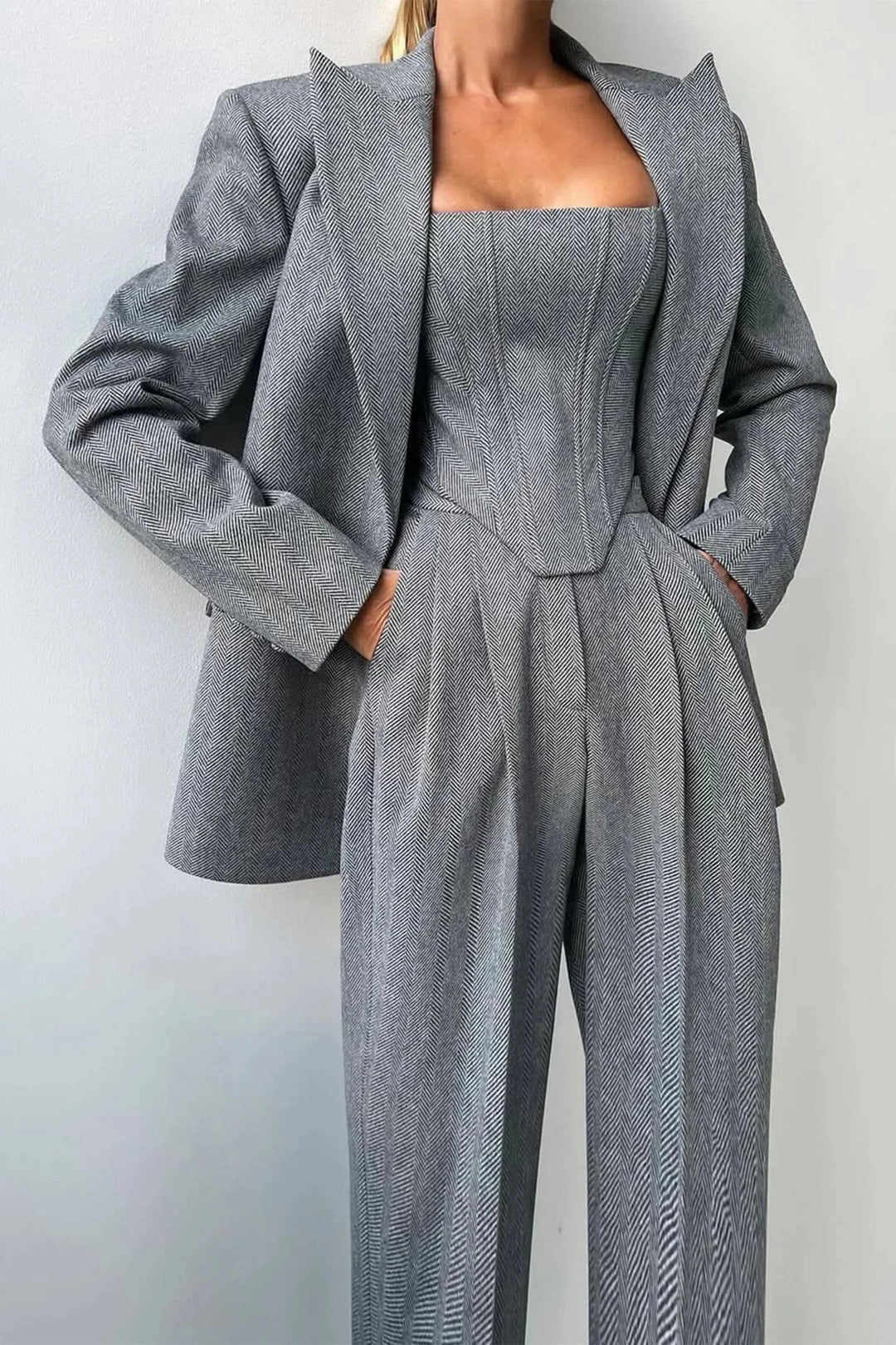 Women's chic 3-piece set: corset bustier, wide leg pants & oversized blazer. Elegant power dressing outfit.
