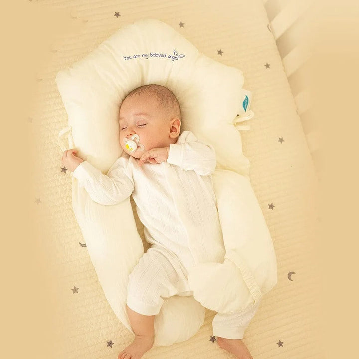 "Ergonomic infant support pillow with adjustable sides, recessed head zone for comfort and alignment, soft exterior, baby-saf