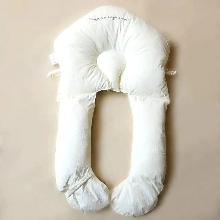 "Ergonomic infant support pillow with adjustable sides, recessed head zone for comfort and alignment, soft exterior, baby-saf