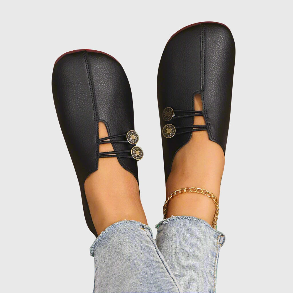 Pair of Evelyn neutral button flats on white background, slip-on flats for women, versatile everyday casual shoes