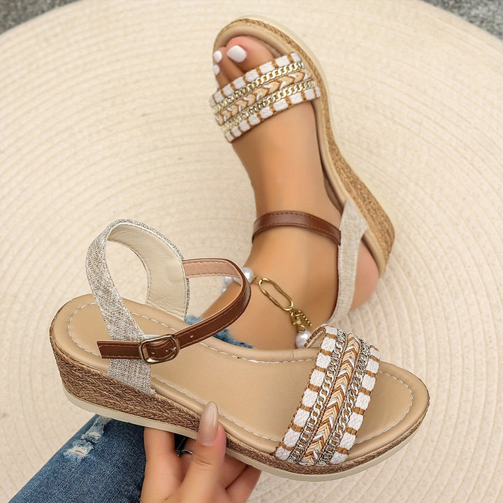 Elegant women's heeled sandals featuring a cushioned orthopedic wedge & secure crossed straps.