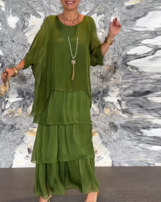 Elegant women's tiered maxi dress with long sleeves, offering a relaxed fit and effortless flowy style.
